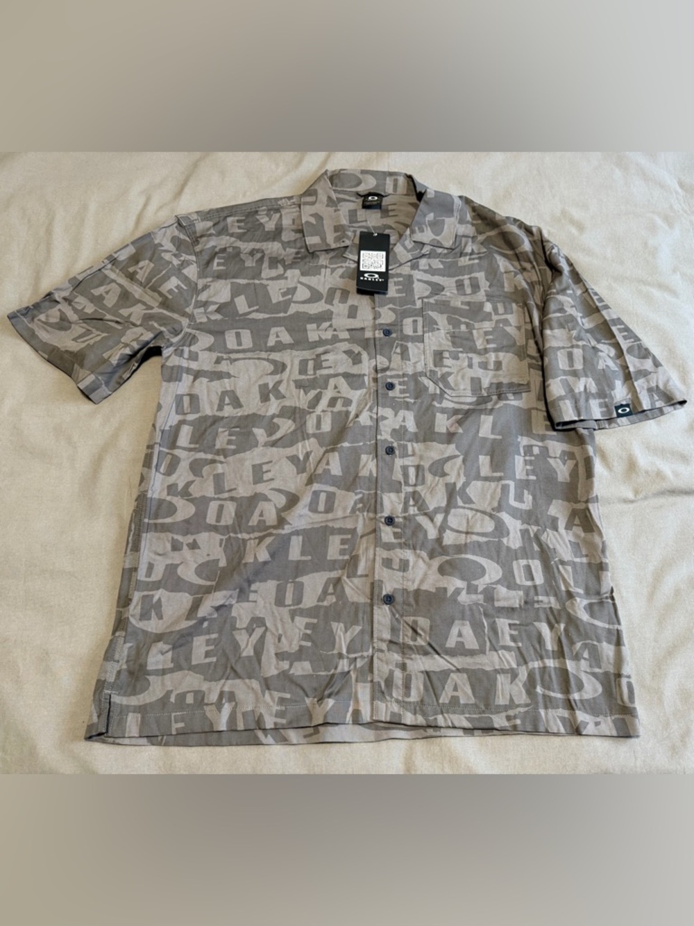 Oakley Woven Update Button Up Shirt Mens Large NWT Collage Storm Pattern AOP